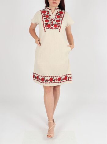 Rochie traditionala cu broderie, buzunare si maneca scurta.
